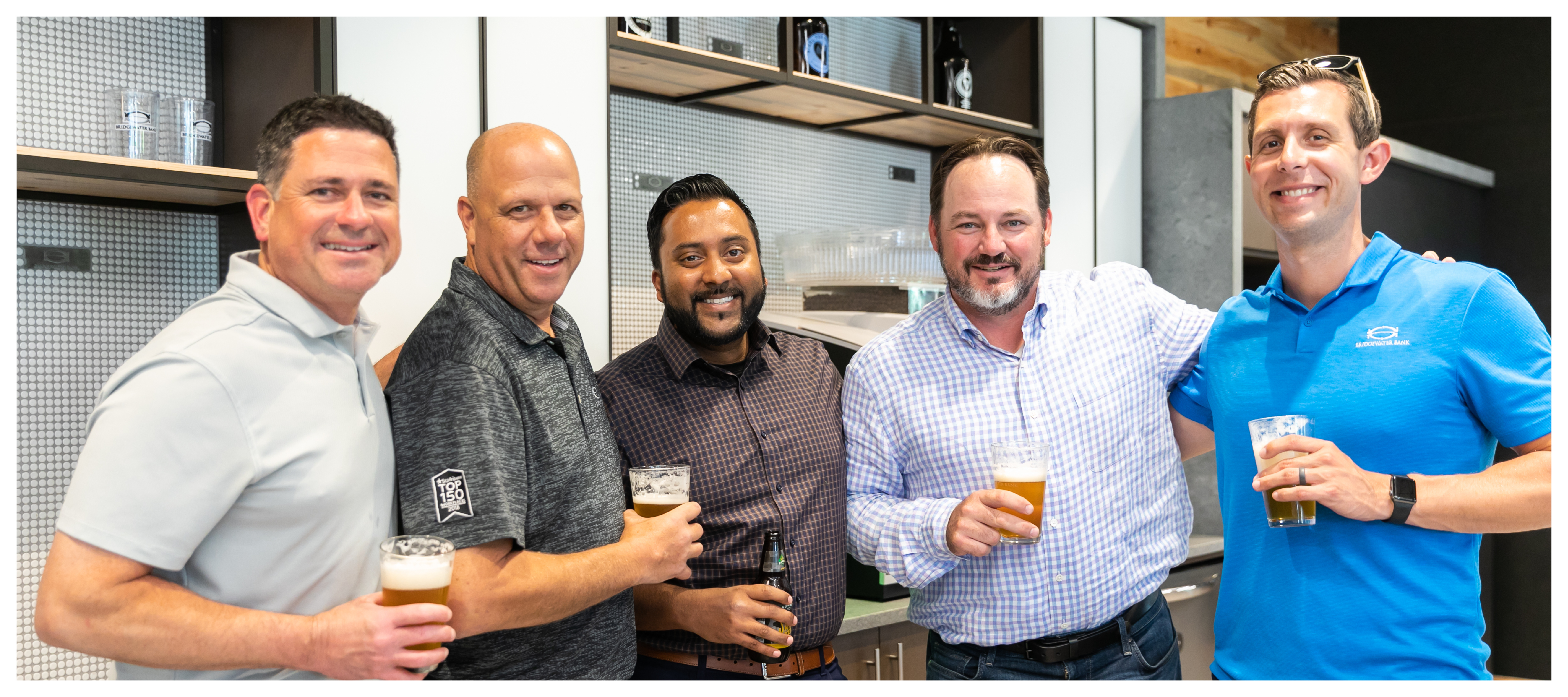 Group photo of CashBank Group team members at an internal happy hour.